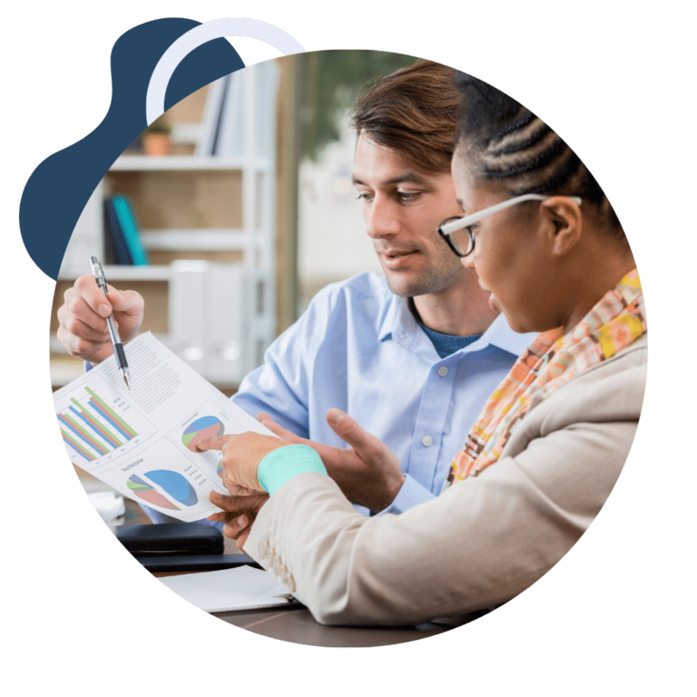 man explaining to woman the financial reporting in chart format that may be included in fractional CFO services